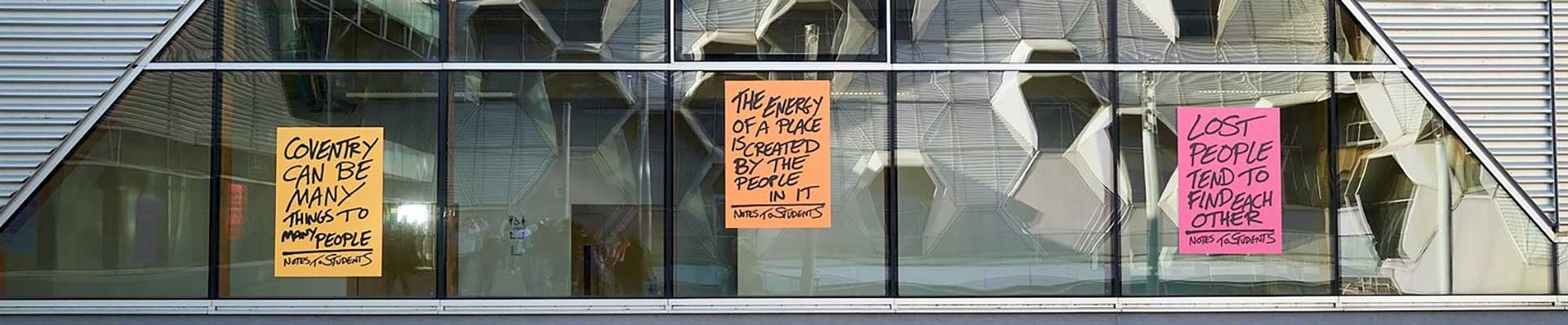 Andy's signposts on the side of the building