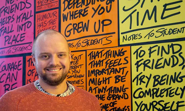 Image of Andy Look in front of his notes