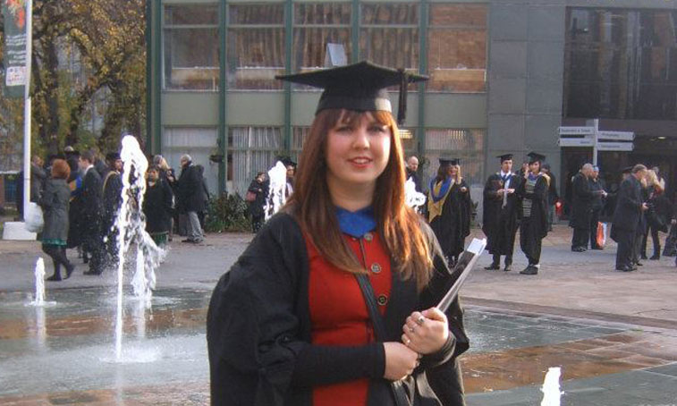 Emilie smiling at her graduation