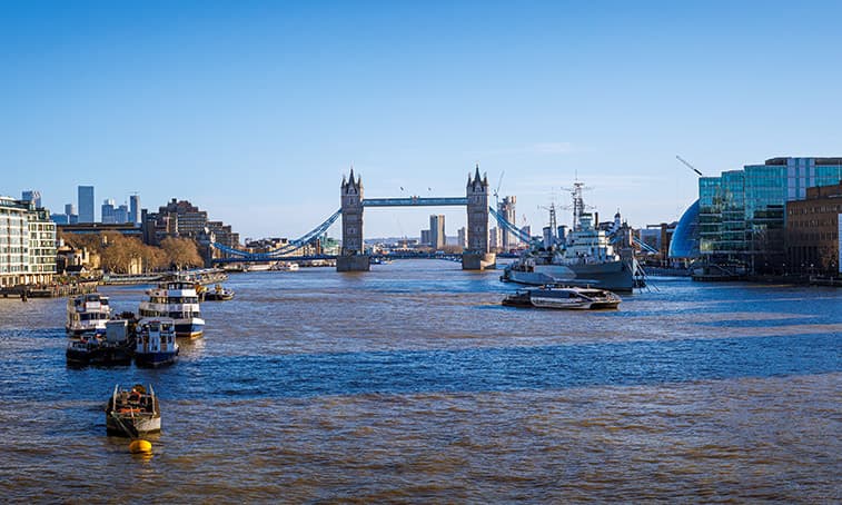 River thames with the tower of london bridge in the distance