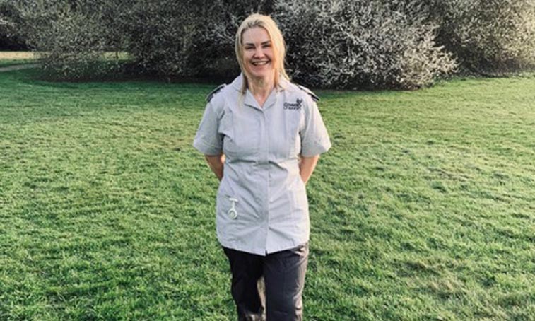 Tracey Porter smiling in her nursing uniform
