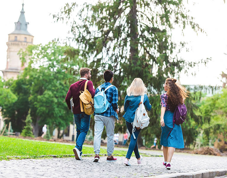 A group of students walking on a university campus