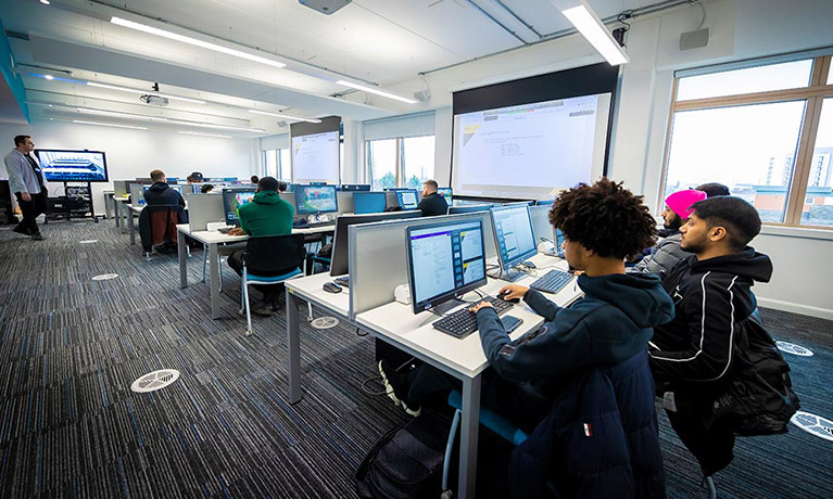 Students working on computer in a classroom