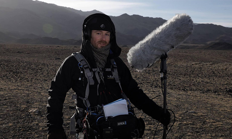 David Hamill operating a boom mic