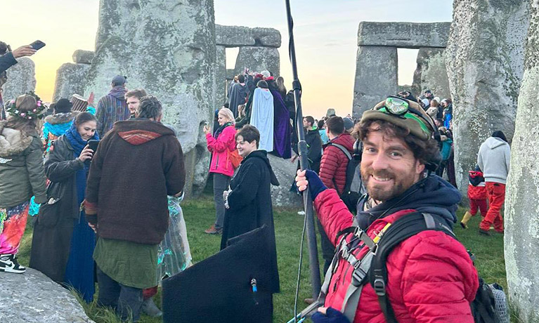 David Hamil holding a boom mic at Stonehenge