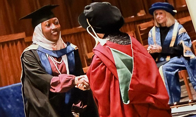 Dr Aisha Abdullahi Mahmoud on stage at her graduation