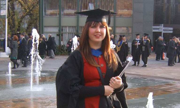 Emilie smiling at her graduation