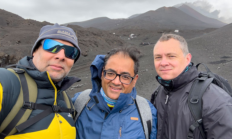 three people posing for a photo together