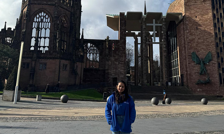 Gimhani Karunaratne standing outside of the Coventry cathedral