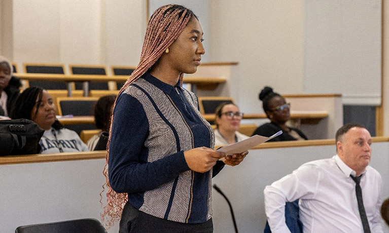 Woman presenting in a moot room