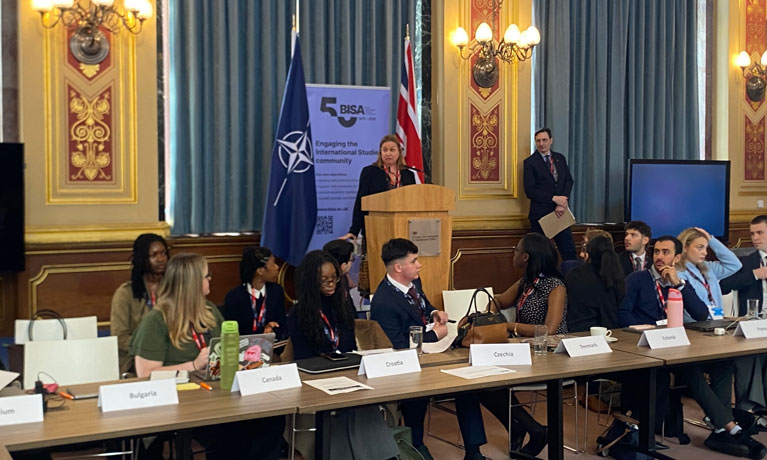 students seated at a conference table