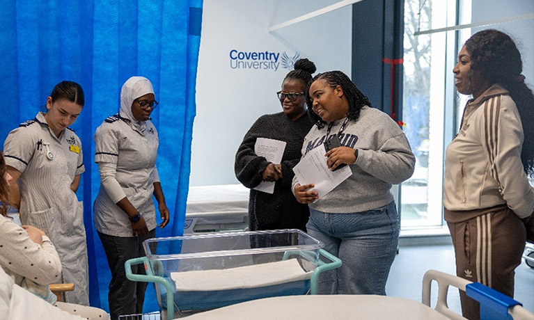 nursing students talking to a patient