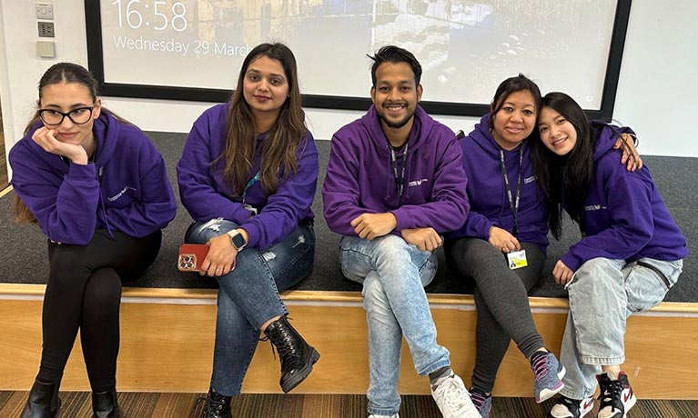 Sadakat with a group of students