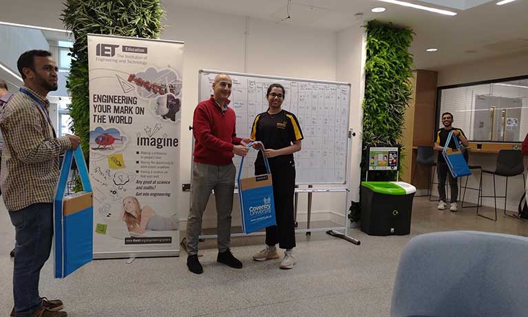Sri-being-presented-with-a-bag-767x460.jpg
