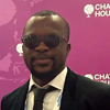 Samson Banjo Adeoye wearing sunglasses and a suit