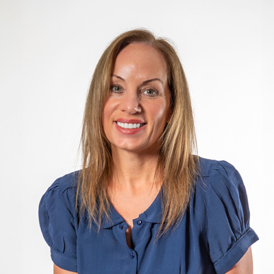 A headshot of Sarah Armstrong-Smith smiling at the camera
