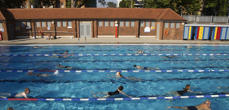 People swimming lengths in the lido