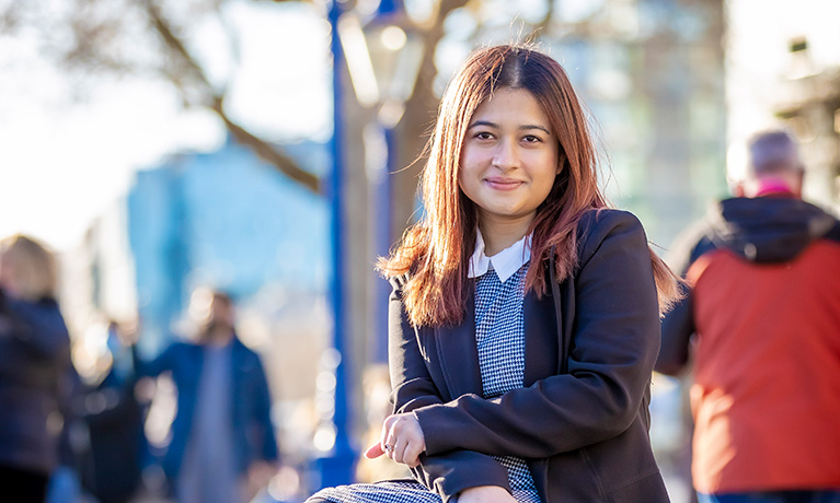 Coventry University London student, Amrin Alim, by the River Thames