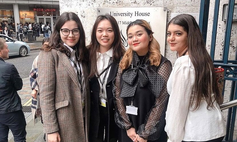 group of girls in front of building