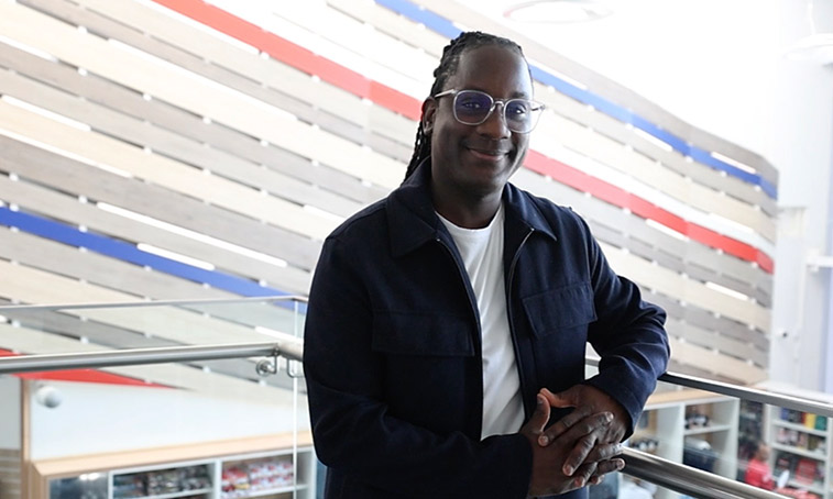 James smiling at the camera