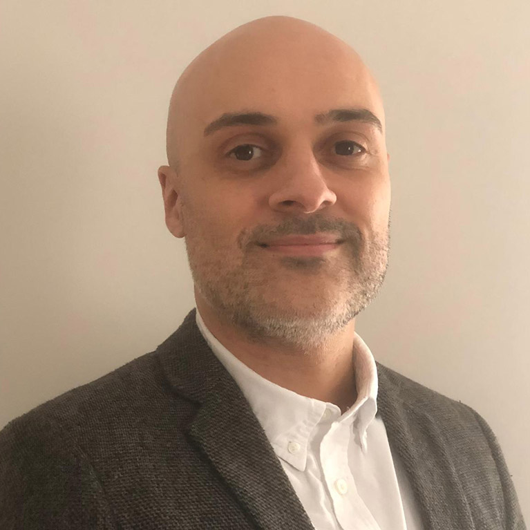 Headshot of Dylan Cozens smiling at the camera.