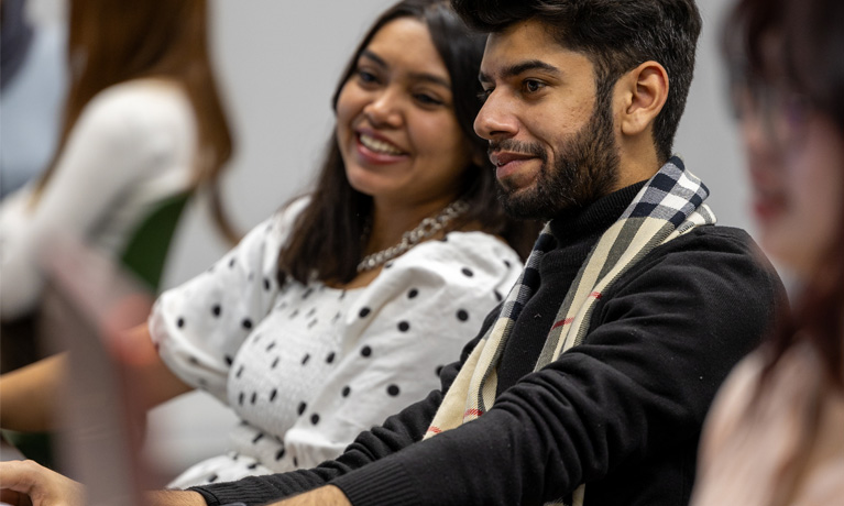 Students studying at computers at Coventry University.