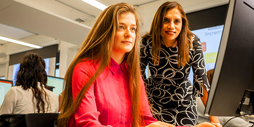 Student and tutor working at a computer