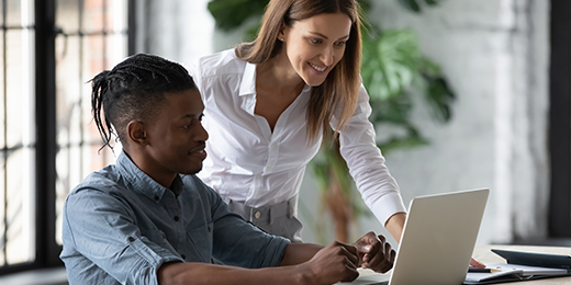 A student studying with a laptop and earphones