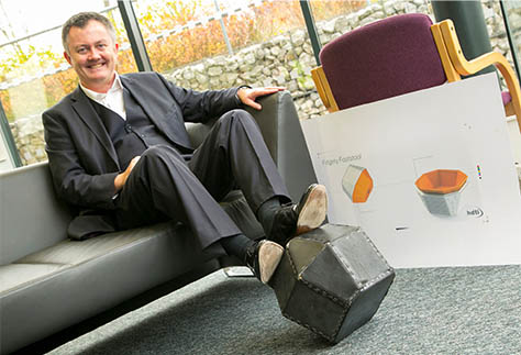 Man using Fidgety Footstool