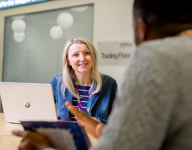 woman talking to her co worker