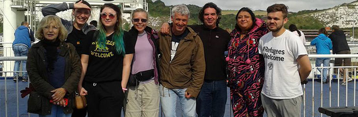 A group of people together on a boat to calais