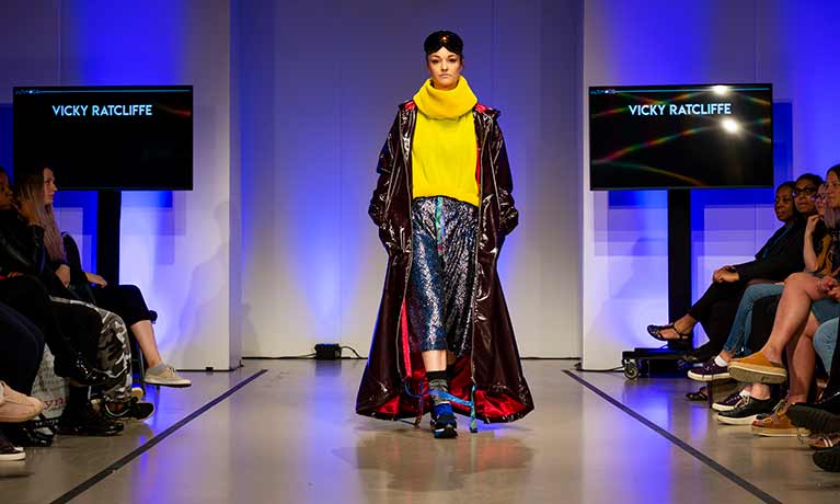 Fashionable woman walking down the catwalk