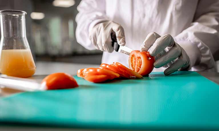 Tomatoes being chopped up