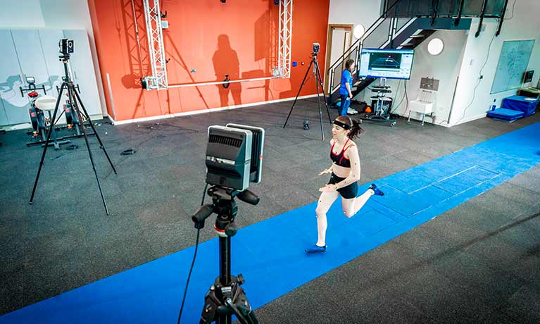 Female student using gait analysis facilities