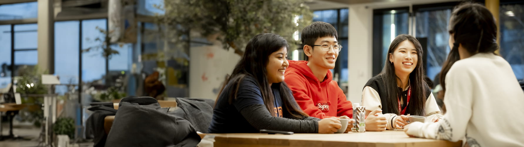 group of students sitting together in a communal area