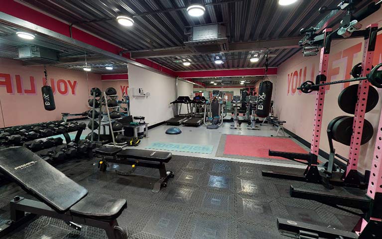 gym room with gym equipment at east coast property