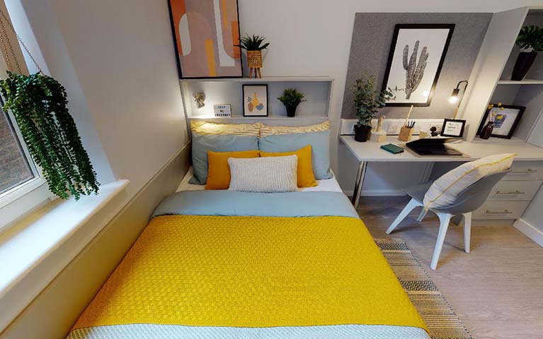 image of bed with yellow bedding 