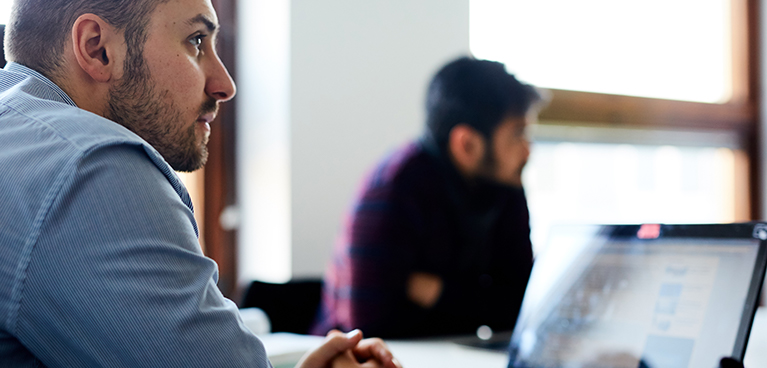 two male students studying in a seminar room