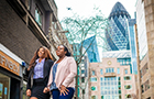 Students walking through London's financial centre