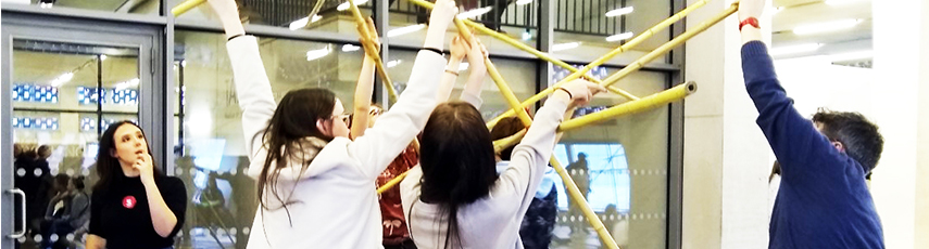Tate Master class students holding up a structure art piece