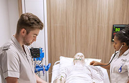 Students using a mock hospital ward