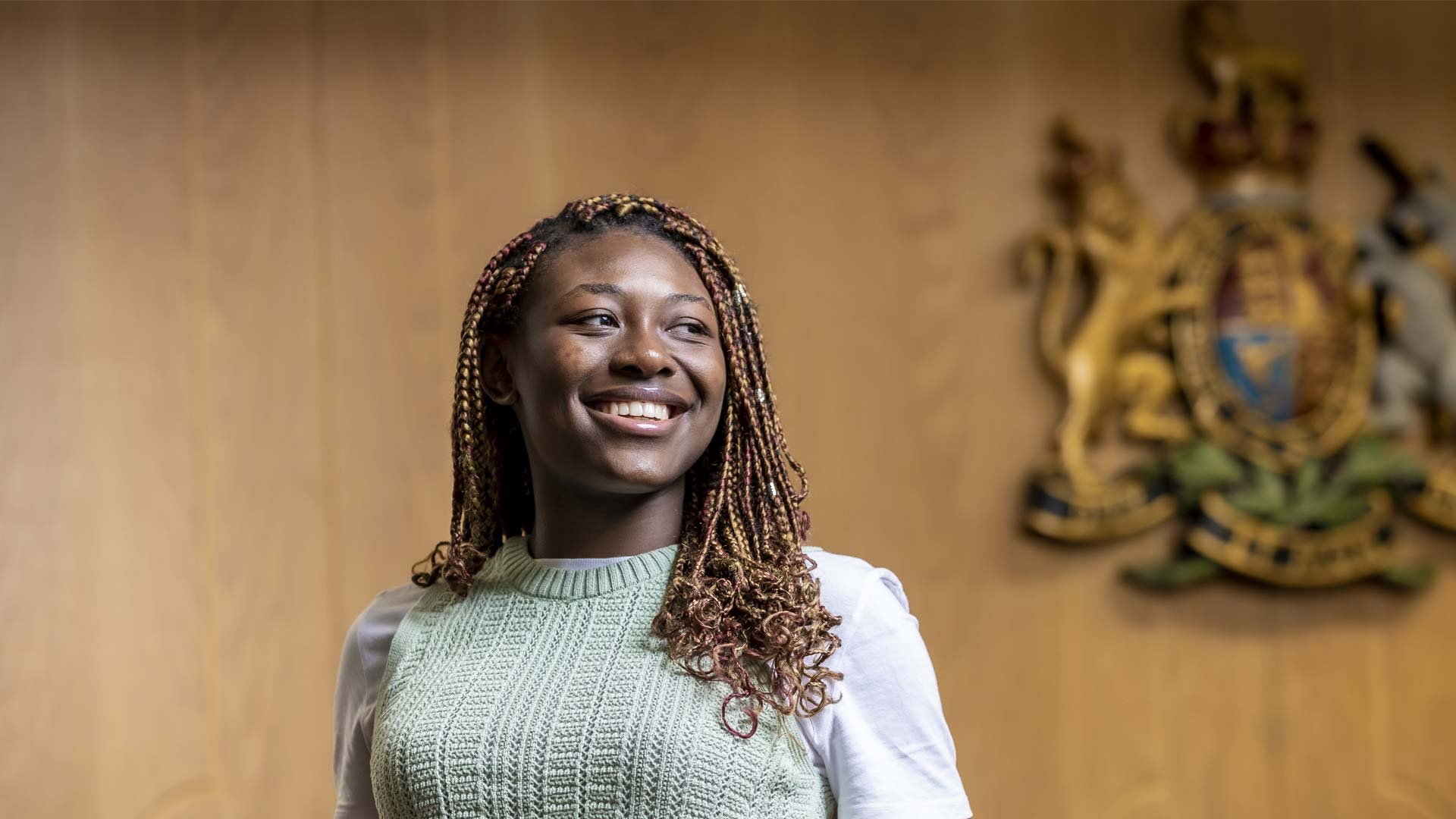 A student smiling in the moot courtroom.