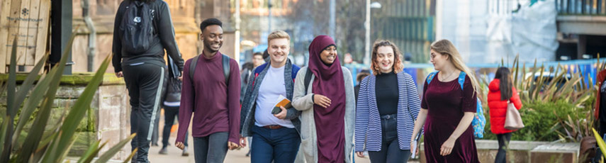 Group of students walking through Coventry city centre