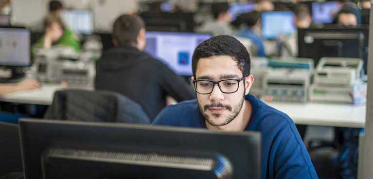Close up on man looking at monitor