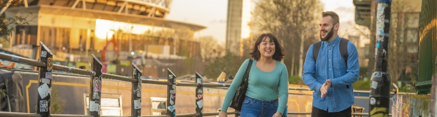 Students walking in front of river