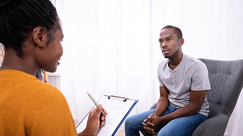 Two Applied Psychology students roleplaying as therapist and patient