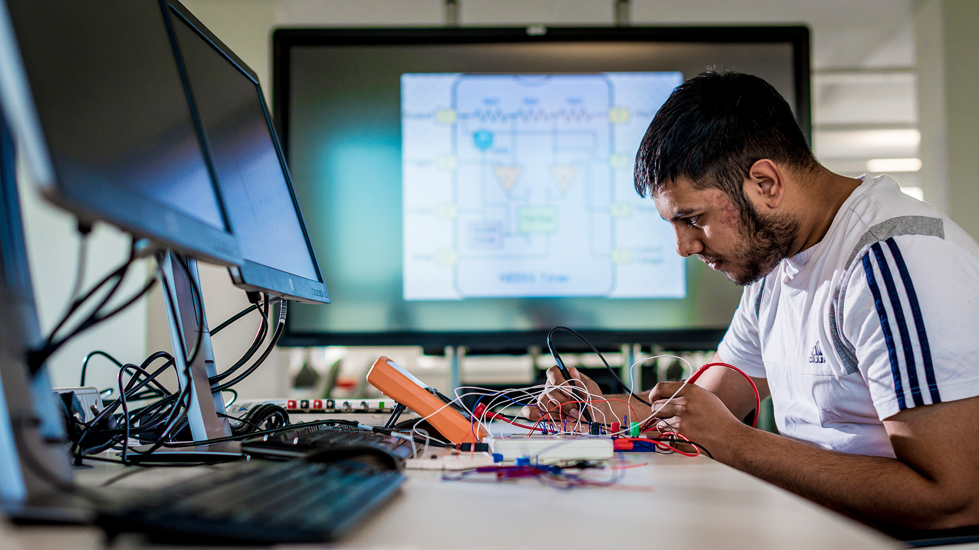 Engineering student wiring their project