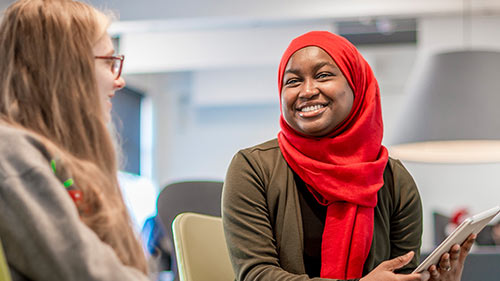 Two Health and Social Care students in discussion