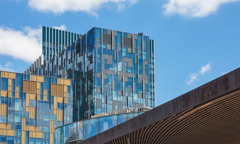 The 6 Mitre Passage building photographed against a blue sky.