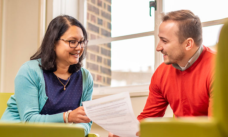 Two students listening